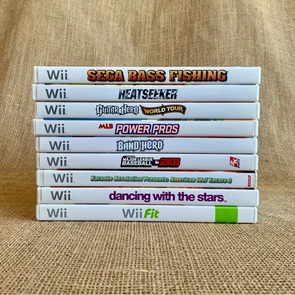 Bundle of 9 Wii Games, 3 Wii Nunchuks and 2 Controller Cases
